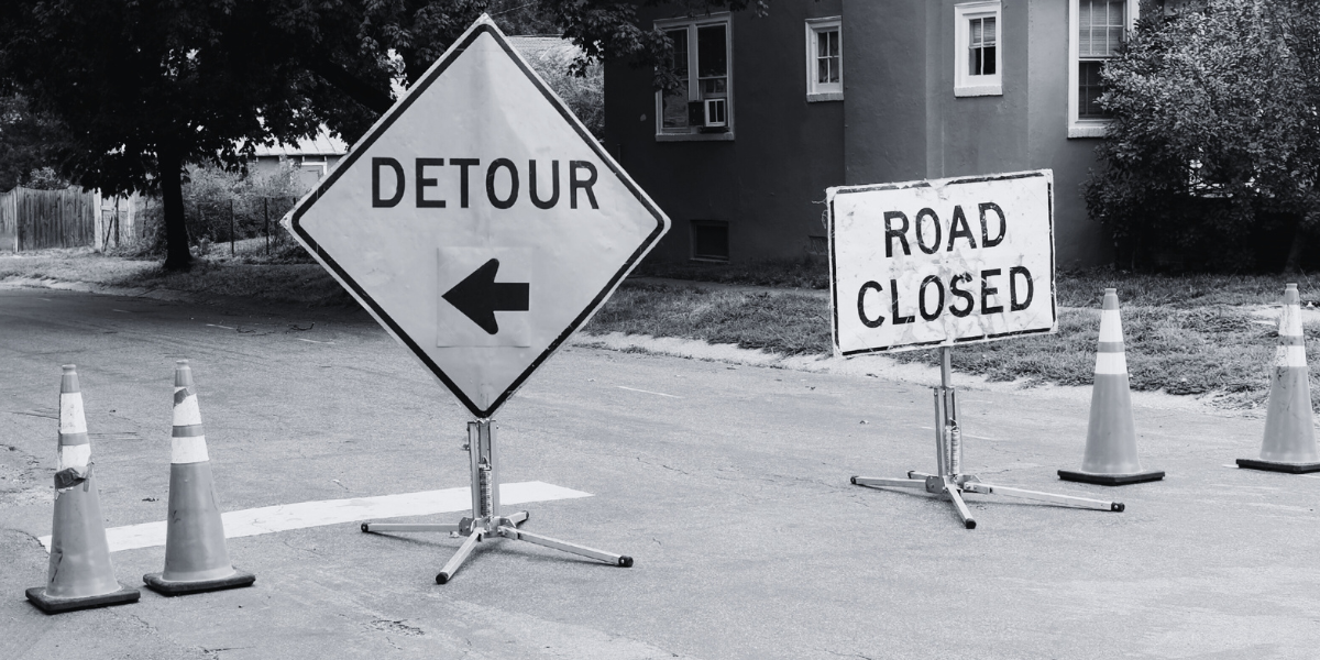 Street closure with Detour and road closed signs